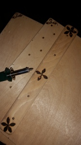 Holes drilled and spine given a few simple woodburned decorations.